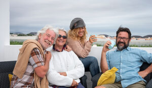 Group of happy adult friends enjoying their newly purchased home in the Ortley Beach real estate market